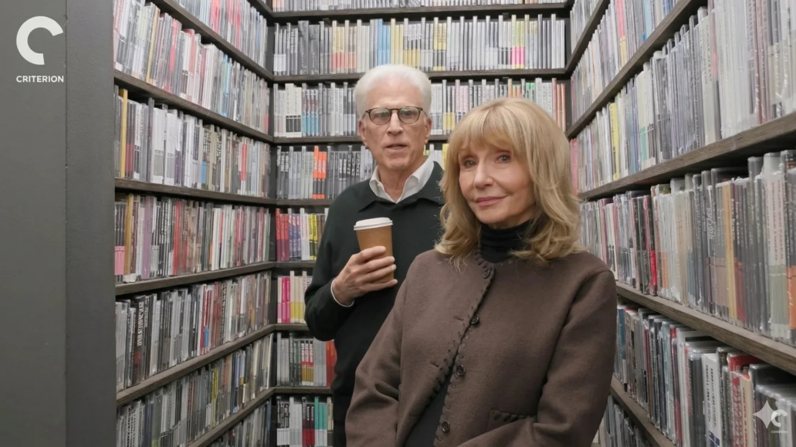 Ted Danson bold and married, standing with his wife Mary Steenburgen in a library